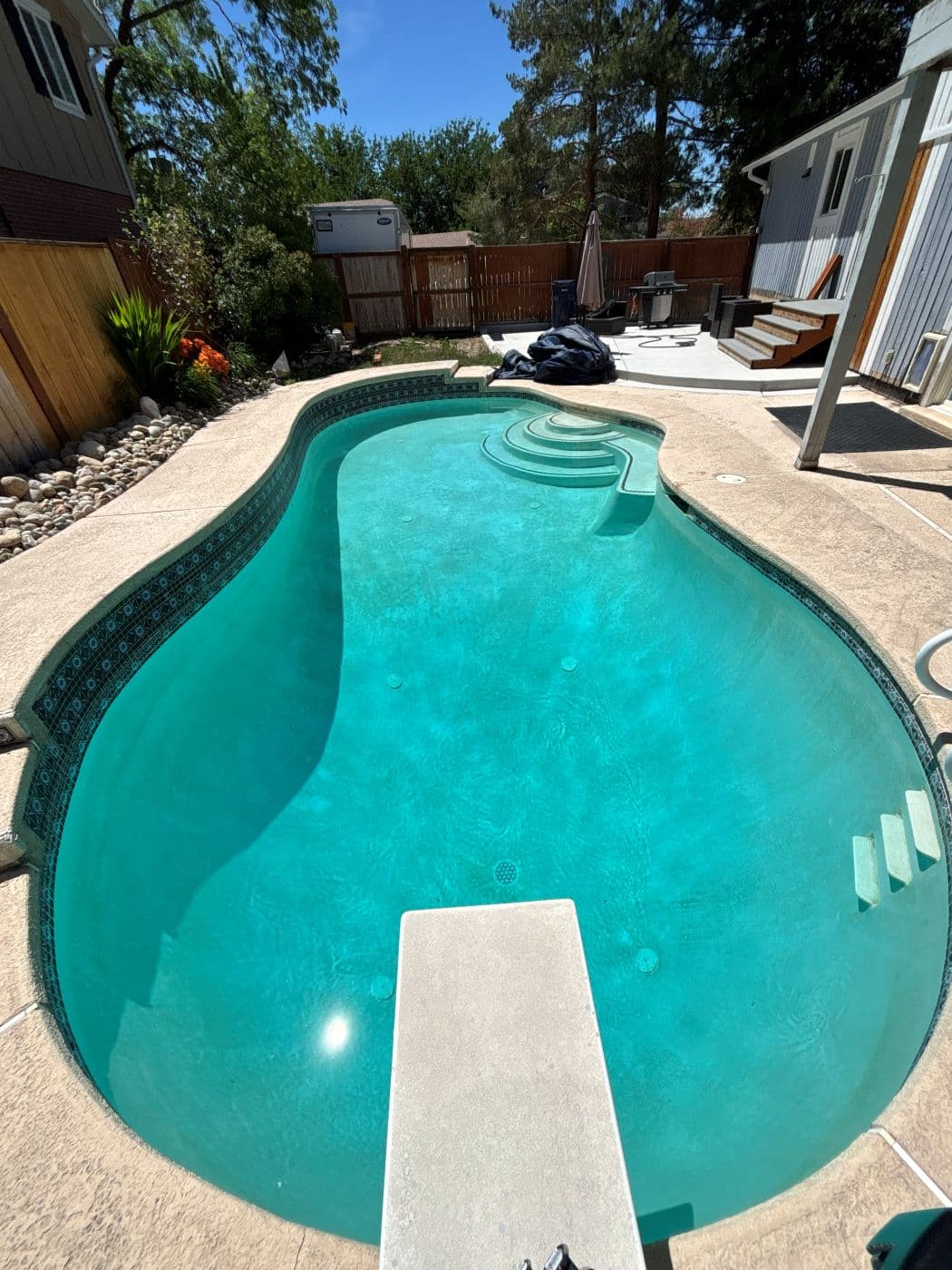 The same pool with clear turquoise water after recovery